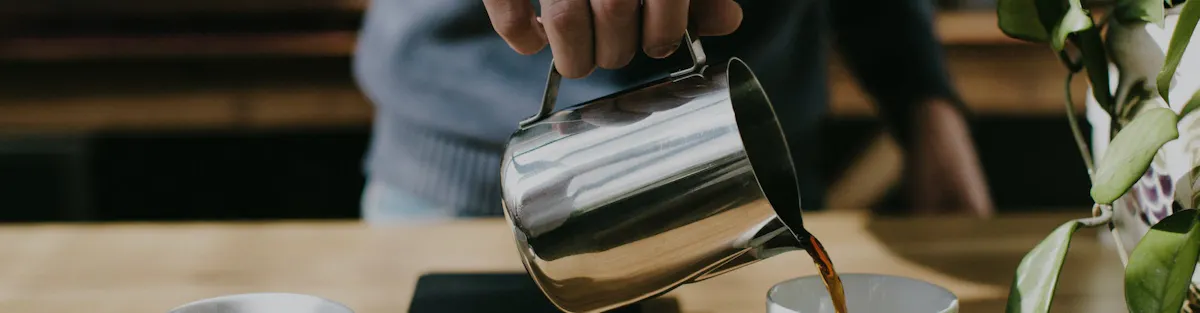 Coffee lover pouring a cup of Peet's coffee from a pitcher