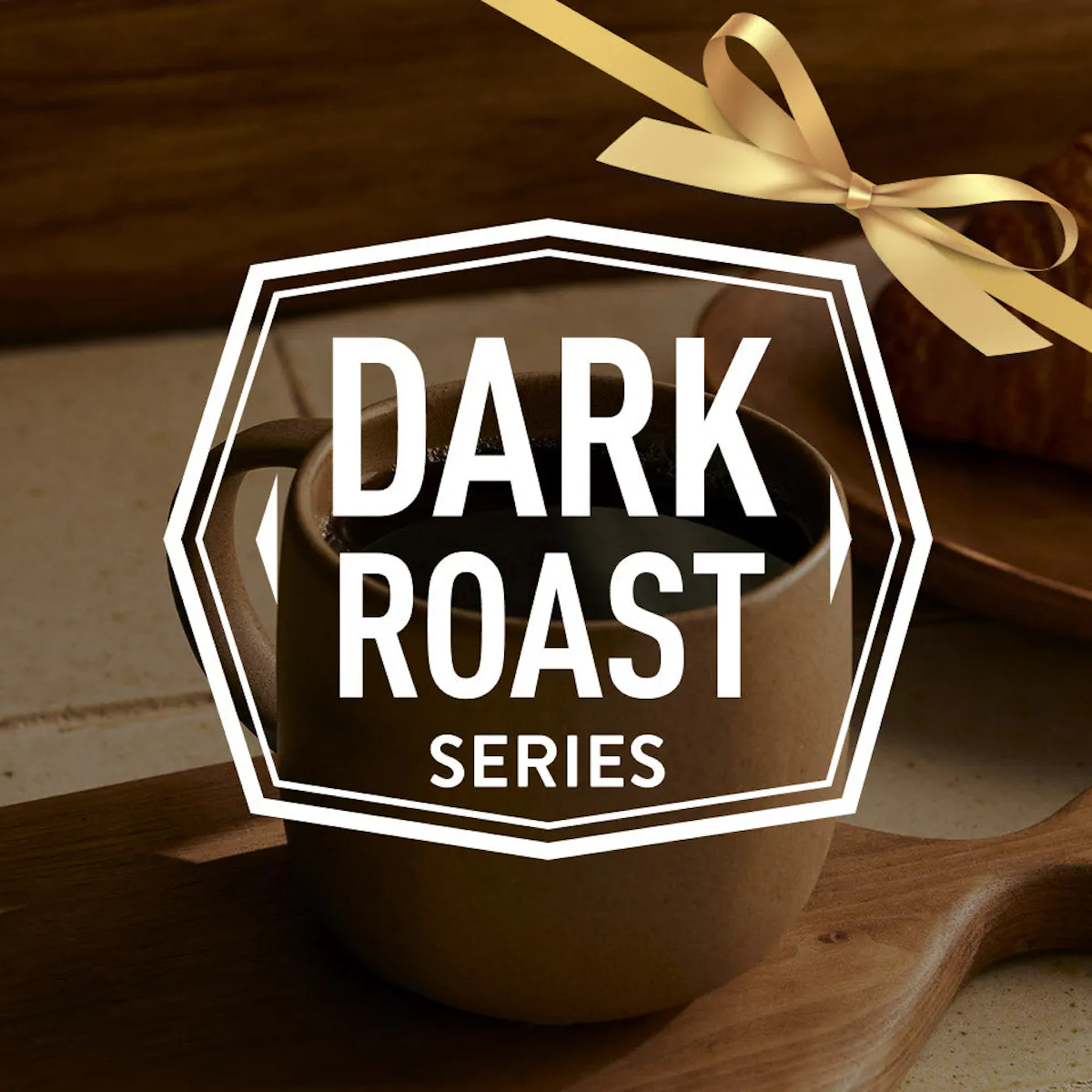 Mug of dark roast coffee with a decorative bow on a wooden surface, featuring 'Dark Roast Series' text.